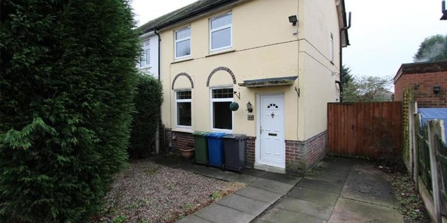 house with concrete front garden