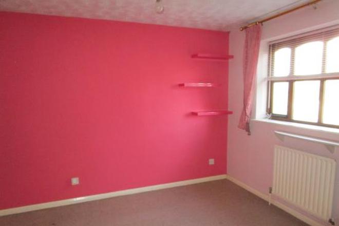 room with a pink wall