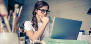 women scowling at laptop