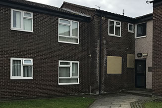 Front of a property with dark brick