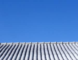 blue sky, white tiled roof